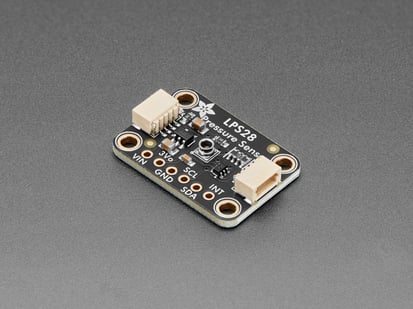Angled shot of black, rectangular, pressure sensor breakout.