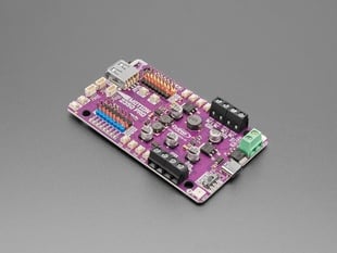Angled shot of purple, rectangular, robotics controller PCB.