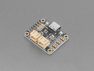 Angled shot of black, square-shaped lipoly battery charger PCB.