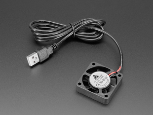 Angled shot of small, black, square USB fan with coiled USB-A cable.