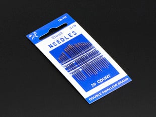 Small blue packaging containing 20 sewing needles.