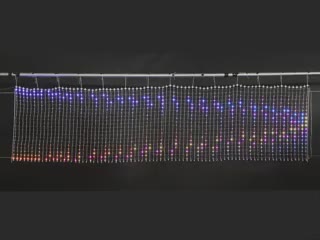 Video of LED netting emitting a a brightly colored wavelength animation.