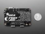 Back of black, rectangle PCB with four black rubber bumper feet.