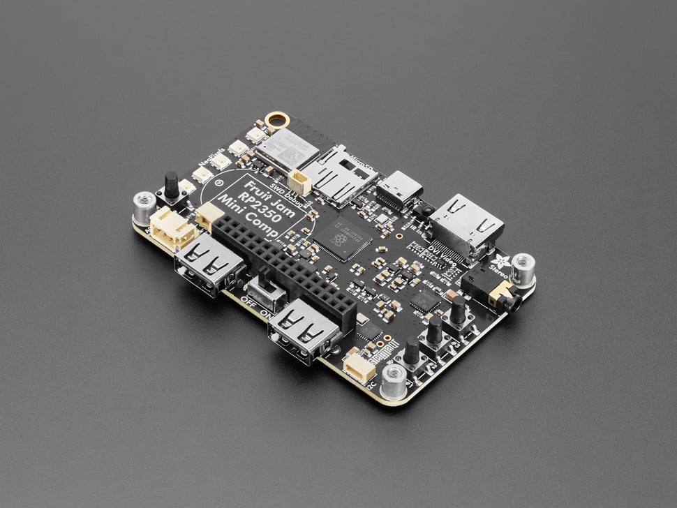 Overhead shot of black, credit-card-sized microcontroller.