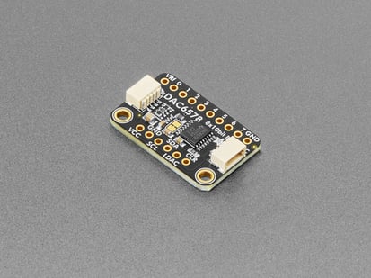 Angled shot of black, rectangular DAC breakout board.