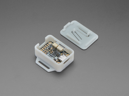 Angled shot of two-piece white plastic enclosure with LED driver board inside.