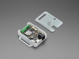 Angled shot of LED driver board in half-assembled enclosure.