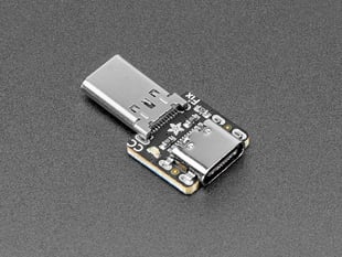 Angled shot of USB-C breakout board with plug and socket connectors.