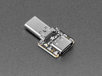Angled shot of USB-C breakout board with plug and socket connectors.