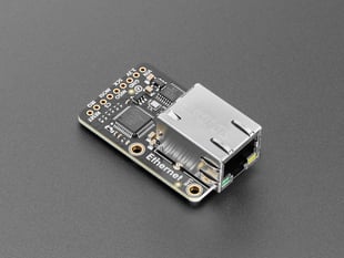 Angled shot of black, rectangular, Ethernet breakout board.