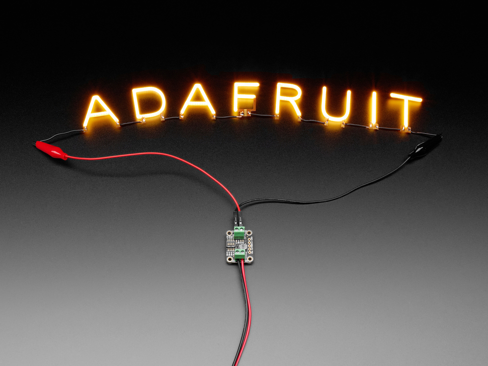 Demo Shot of the Constant Current Boost Converter powering LED Letter Filaments that spell out "Adafruit".
