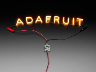 Demo Shot of the Constant Current Boost Converter powering LED Letter Filaments that spell out "Adafruit".