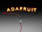 Demo Shot of the Constant Current Boost Converter powering LED Letter Filaments that spell out "Adafruit".