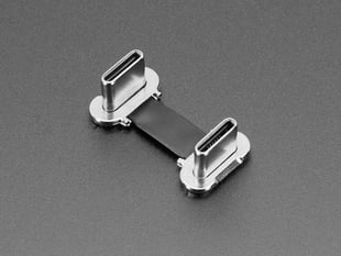 Angled shot of a small, slim, 23mm long right angle USB C to USB C cable.
