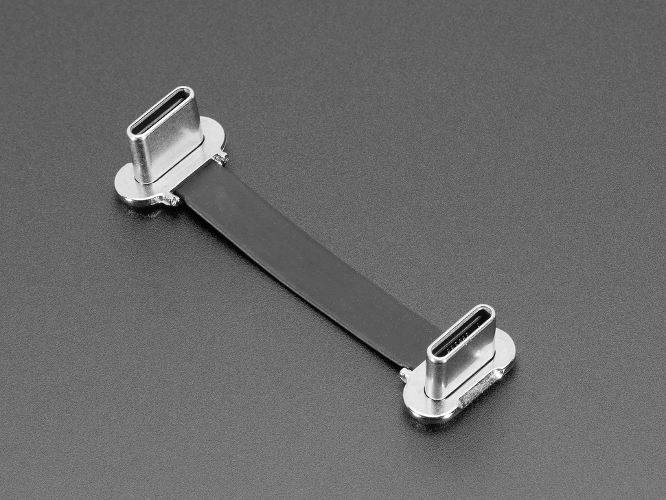 Angled shot of a small, slim, 40mm long right angle USB C to USB C cable.