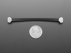 100mm long slim, right angle USB C to USB C cable with U.S. quarter for scale.