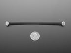 150mm long slim, right angle USB C to USB C cable with U.S. quarter for scale.