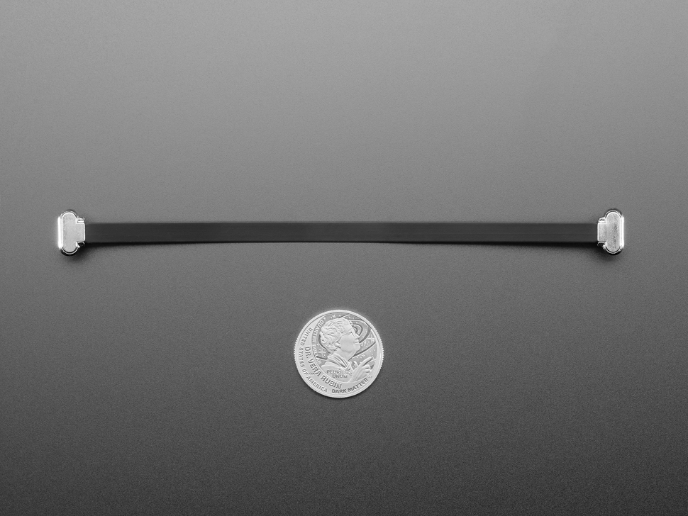 150mm long slim, right angle USB C to USB C cable with U.S. quarter for scale.