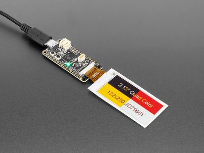 Demo Shot of the 2.13" 250x122 Quad-Color eInk / ePaper - Bare Display connected to an Ink Feature and text "2.13" Quad Color 122x250 JD79661" Displayed on the Screen with the Text and Rectangular shapes in the background in four different colors. 