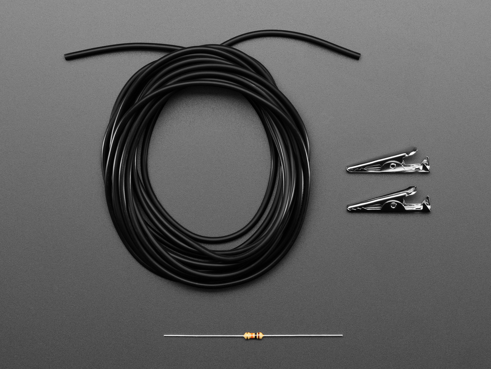 Bundle of black, rubber, conductive cord with two alligator clips and a resistor.