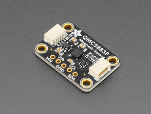 Angled shot of small, black, rectangle-shaped magnetic sensor breakout board.