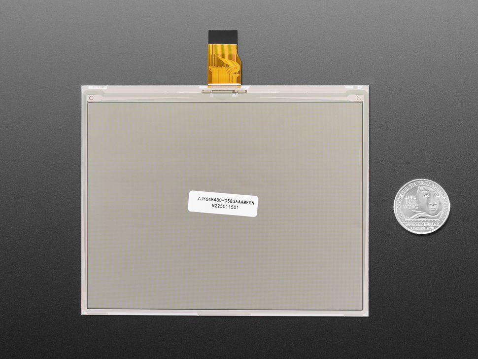 Overhead shot of blank 5.83" monochrome electronic ink display with U.S. quarter for scale.