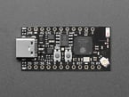 Overhead shot of small, black, rectangle-shaped microcontroller.