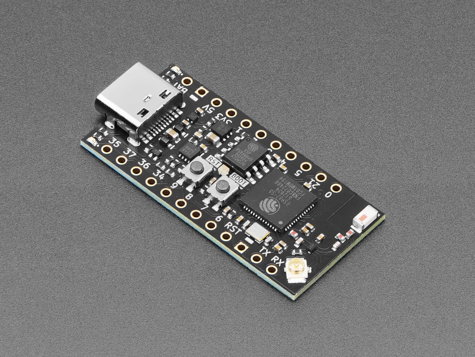 Angled shot of small, black, rectangle-shaped microcontroller.
