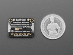 Top Down Back Shot of the Adafruit BMP581 I2C or SPI Temperature Humidity Pressure Sensor next to a U.S. Quarter for Scale.