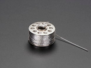 Small spool of conductive thread.