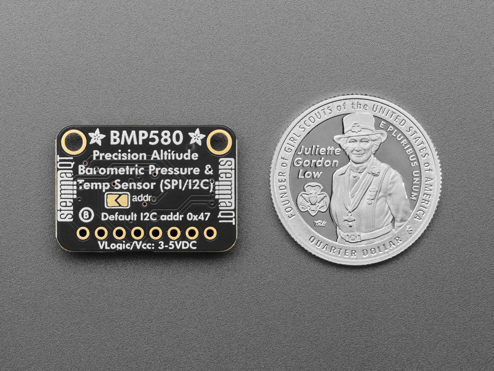 Back of BMP580 temperature and pressure sensor breakout with U.S. quarter for scale.