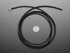 Top Down Shot of the Slim Cable - 1820mm / 6 feet long coiled up next to a U.S. Quarter for Scale.