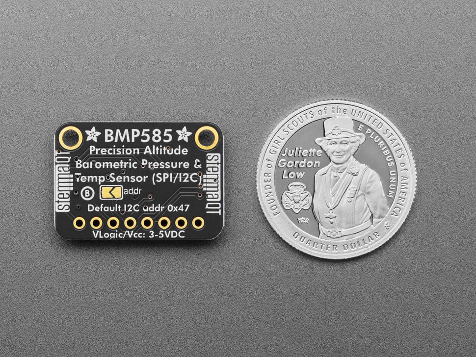 Back of temperature pressure sensor breakout with U.S. quarter for scale.