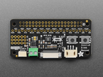 Top-down shot of black, rectangle-shaped electronic ink driver add-on board.