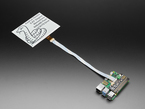 7.5" electronic ink module connected via FPC cable to a Raspberry Pi computer and e-ink driver board.