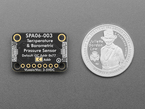Back of temperature and pressure sensor breakout with U.S. quarter for scale.