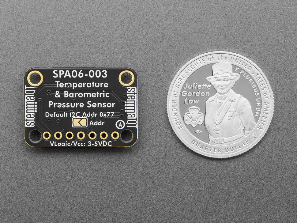 Back of temperature and pressure sensor breakout with U.S. quarter for scale.