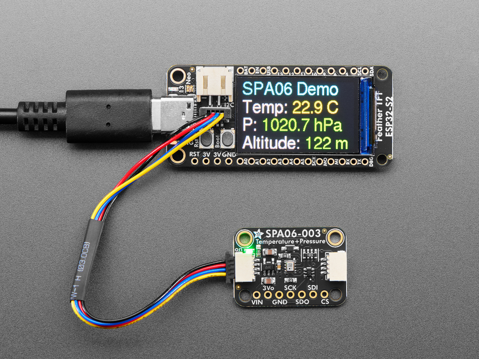 Temperature/pressure sensor breakout hooked up with a microcontroller with a TFT screen, which displays sensor information.