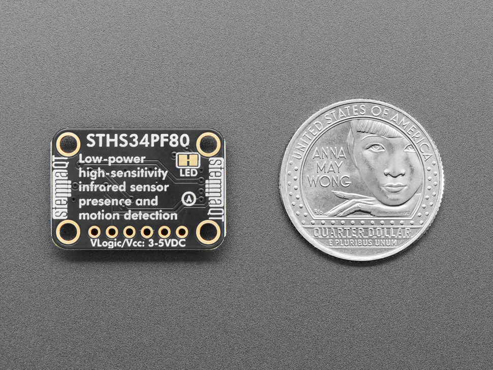 Top Down Back Shot of the Adafruit STHS34PF80 IR Presence / Motion Sensor - STEMMA QT / Qwiic next to a U.S. Quarter for Scale.