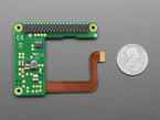 Top Down Bottom Shot of the Raspberry Pi M.2 HAT+ Compact next to a U.S. Quarter for Scale.
