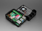 Angled Demo Shot of Raspberry Pi Case + Fan opened up showing the Raspberry Pi 5 equipped with the Raspberry Pi M.2 HAT+ Compact with SSD.