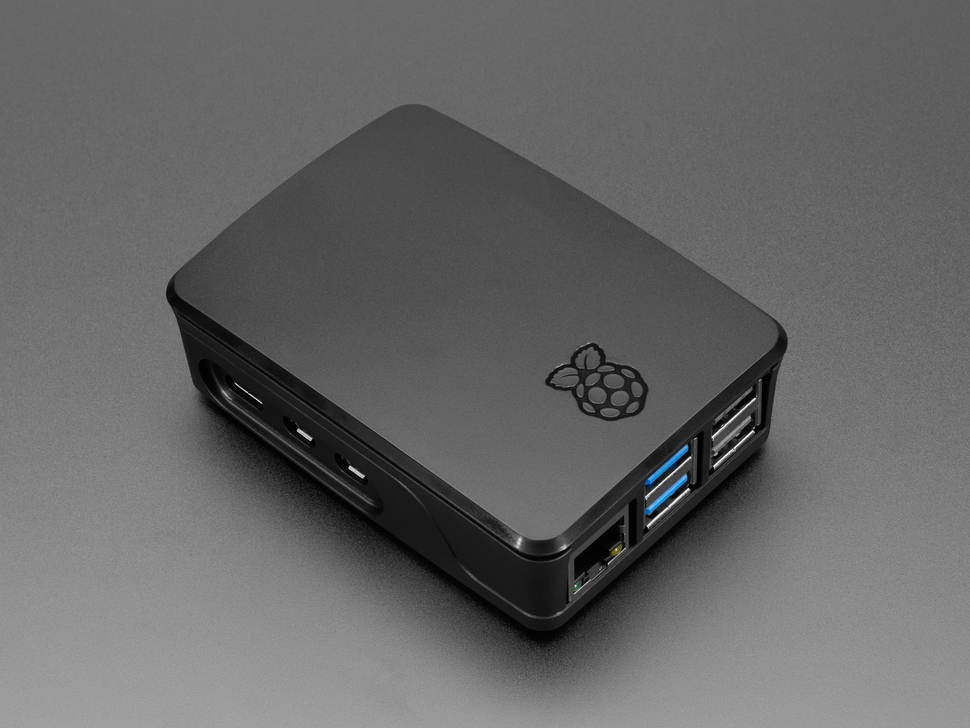 Angled Demo Shot of Raspberry Pi 5 equipped with the Raspberry Pi M.2 HAT+ Compact with SSD that is able to fit into the Raspberry Pi 5 Case + Fan.