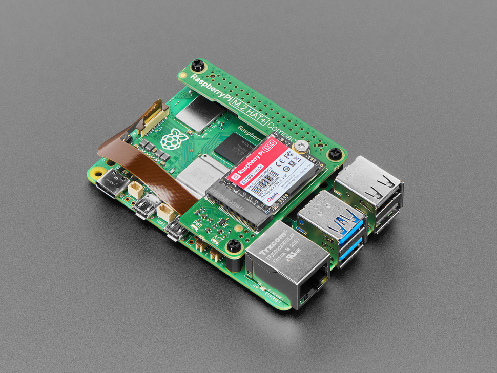 Angled Demo Shot (4) of the Raspberry Pi SSD Connected to the  M.2 HAT+ Compact assembled to the Raspberry Pi 5.