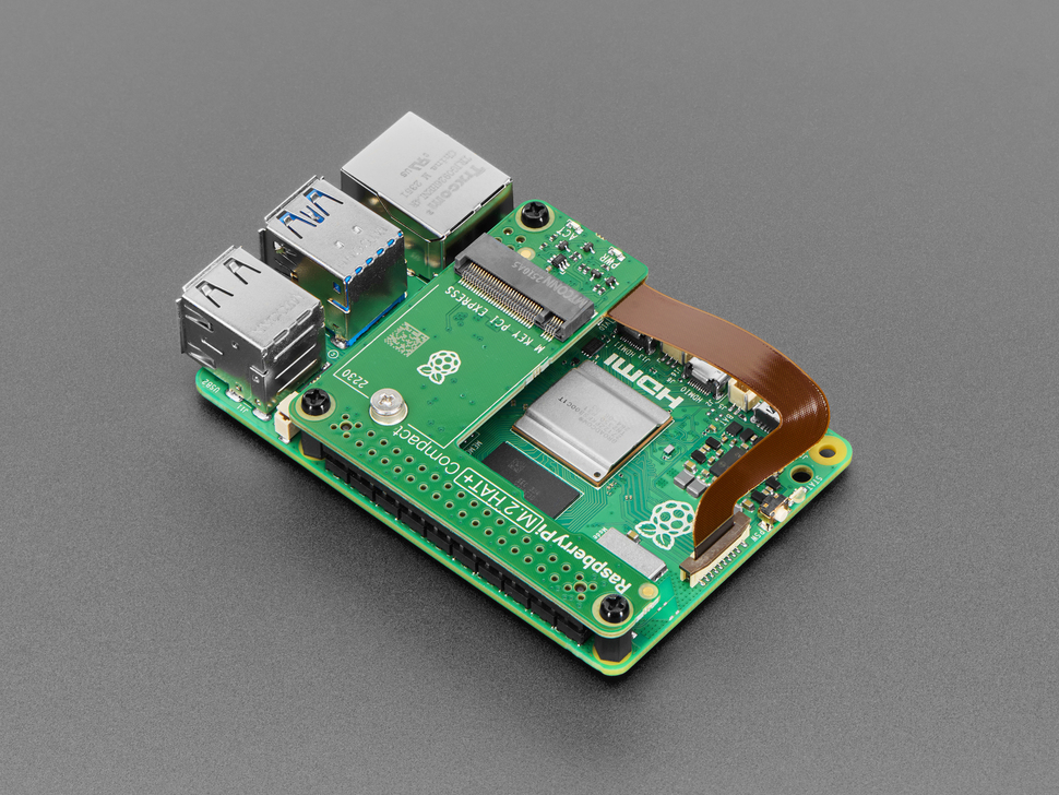 Angled Demo Shot (2) of the Raspberry Pi M.2 HAT+ Compact assembled to the Raspberry Pi 5.