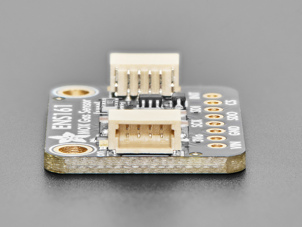 Close-up of tan 4-pin JST-SH connector on PCB.