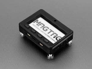 Angled Shot of the Adafruit MagTag Enclosure & Buttons Kit with MagTag and Magnetic Standoff Feet.