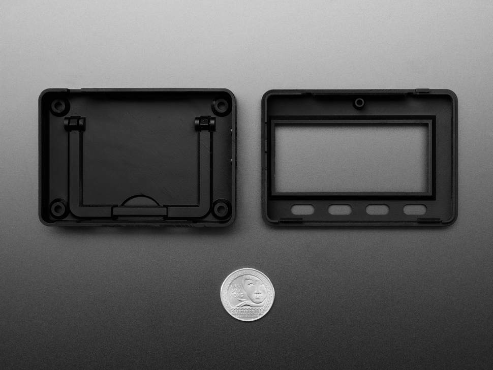 Top Down Interior Shot of the Adafruit MagTag Enclosure Kit next to a U.S. Quarter for Scale.