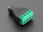 Angled shot of audio jack 4-pin terminal block flipped around to feature the terminal blocks.