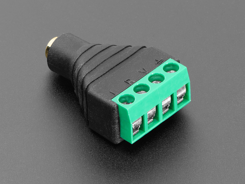 Angled shot of audio jack 4-pin terminal block flipped around to feature the terminal blocks.