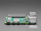 Side profile shot of periphery ports on green microcontroller.